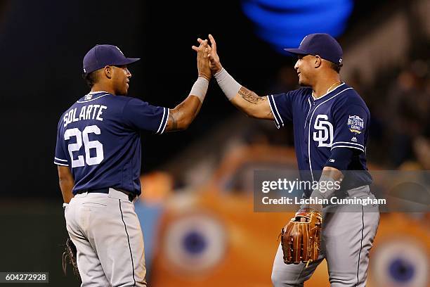 Yangervis Solarte and Oswaldo Arcia of the San Diego Padres celebrate after a win against the San Francisco Giants at AT&T Park on September 12, 2016...