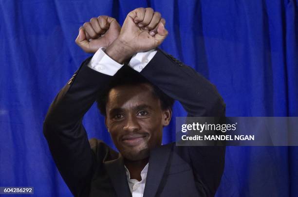 Olympic silver medalist, marathoner Feyisa Lilesa of Ethiopia, arrives for a press conference at a hotel in Washington, DC on September 13, 2016....