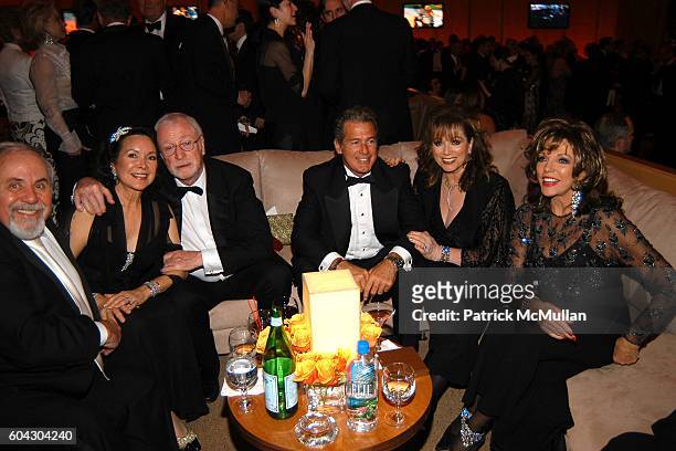 George Schlatter, Jolene Schlatter, Michael Caine, ?, Jackie Collins and Joan Collins attend Vanity Fair Oscar Party at Morton's Restaurant on March...