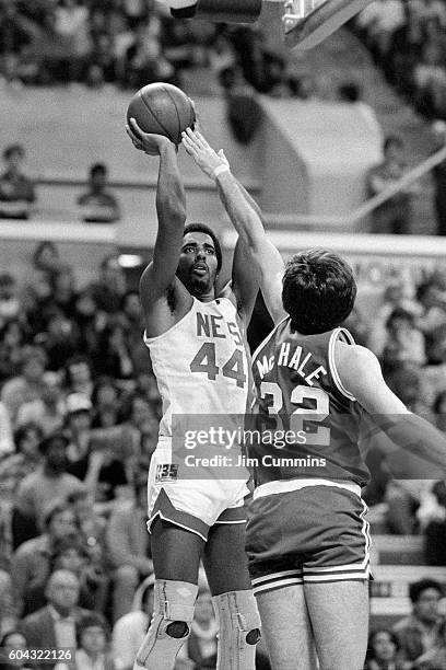 Cliff Robinson of the New Jersey Nets shoots the ball against the Boston Celtics circa 1981 at the Rutgers Athletic Center in Piscataway, New Jersey....