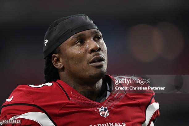 Running back Chris Johnson of the Arizona Cardinals warms up before the NFL game against the New England Patriots at the University of Phoenix...