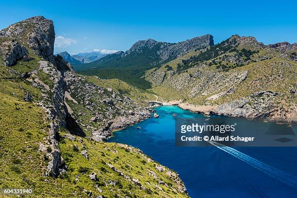ship sailing to bay in cap formentor mallorca - cabo formentor stock pictures, royalty-free photos & images