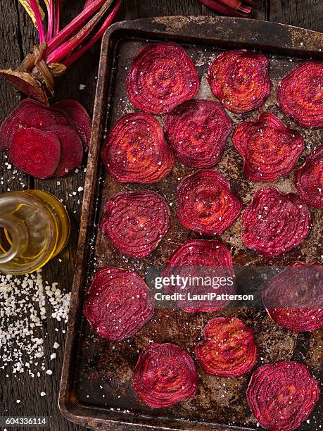 sea salted beet chips - baked sweet potato stock pictures, royalty-free photos & images