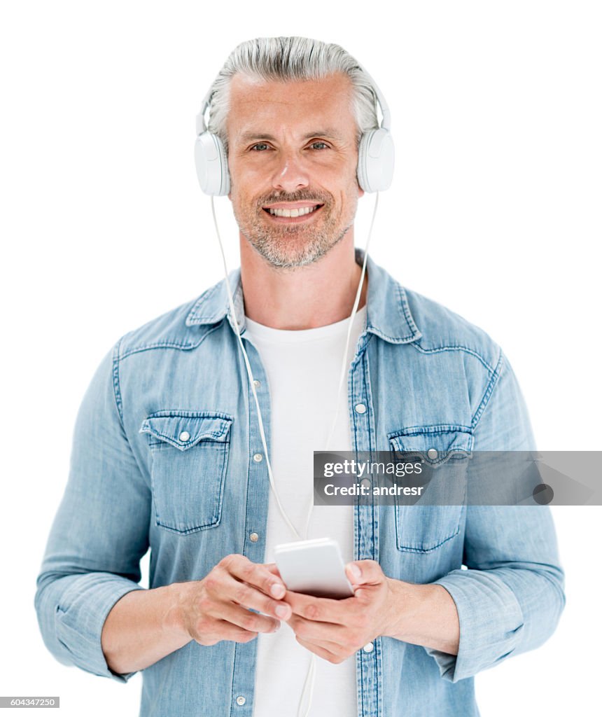 Adult man listening to music on his cell phone