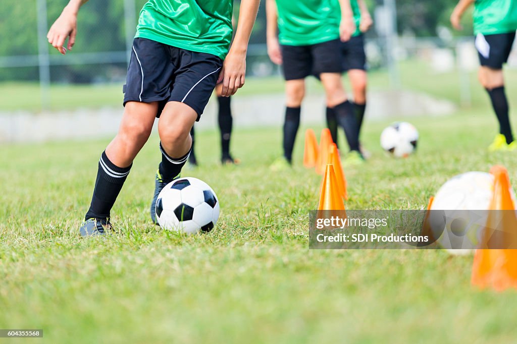 Soccer athlete participates in soccer practice drills
