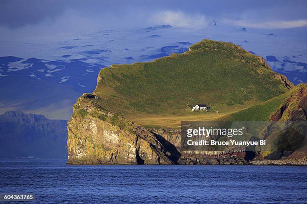 a lonely house on ellidaey island - westman islands stock-fotos und bilder