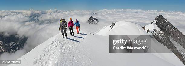 switzerland, western bernese alps, mountaineers in balmhorn region - people climbing walking mountain group stock pictures, royalty-free photos & images