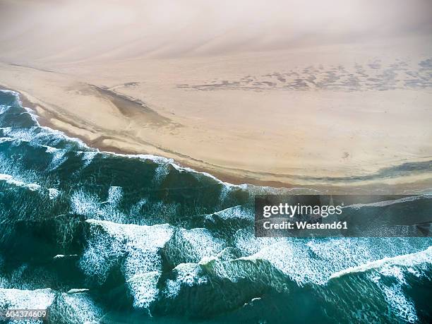 namibia, walvis bay, atlantic meets namib desert, aerial view - bucht walvis bay stock-fotos und bilder