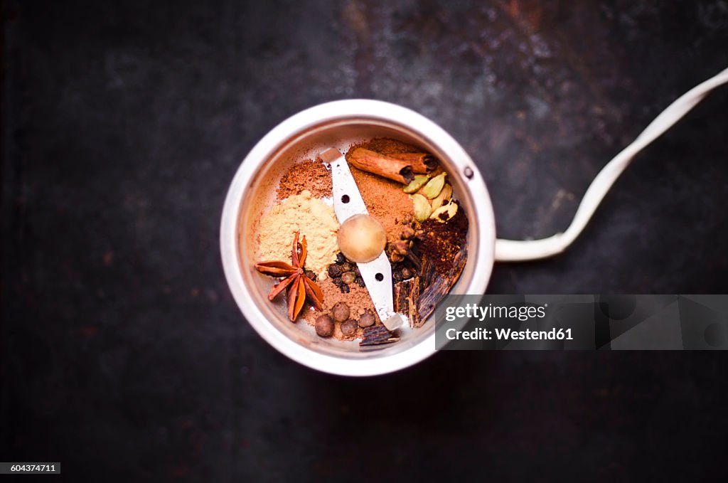 Preparing gingerbread spice with coffee mill