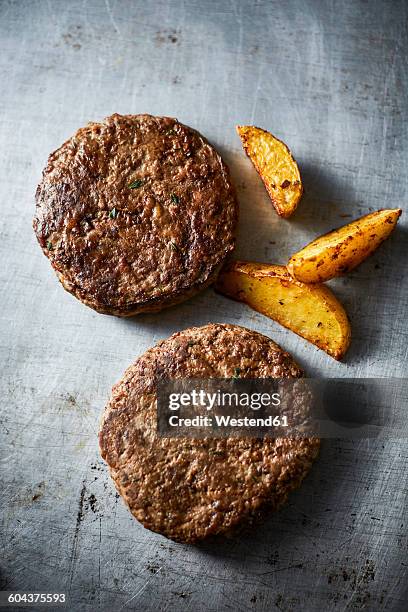 fried ground beef, burger and potato wedges - potato wedges stock pictures, royalty-free photos & images