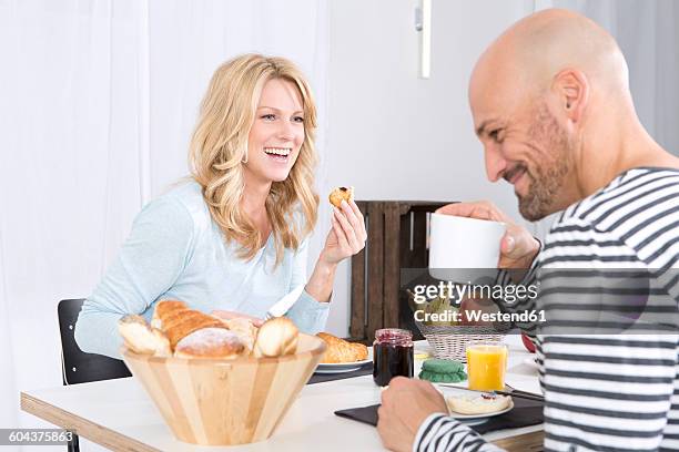 happy couple having breakfast at hoome - modern hoome stock pictures, royalty-free photos & images