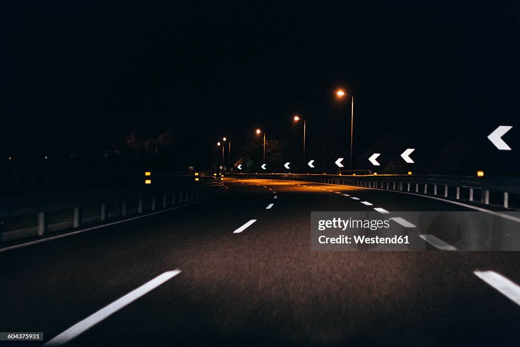Italy, Udine, driving at night along the highway