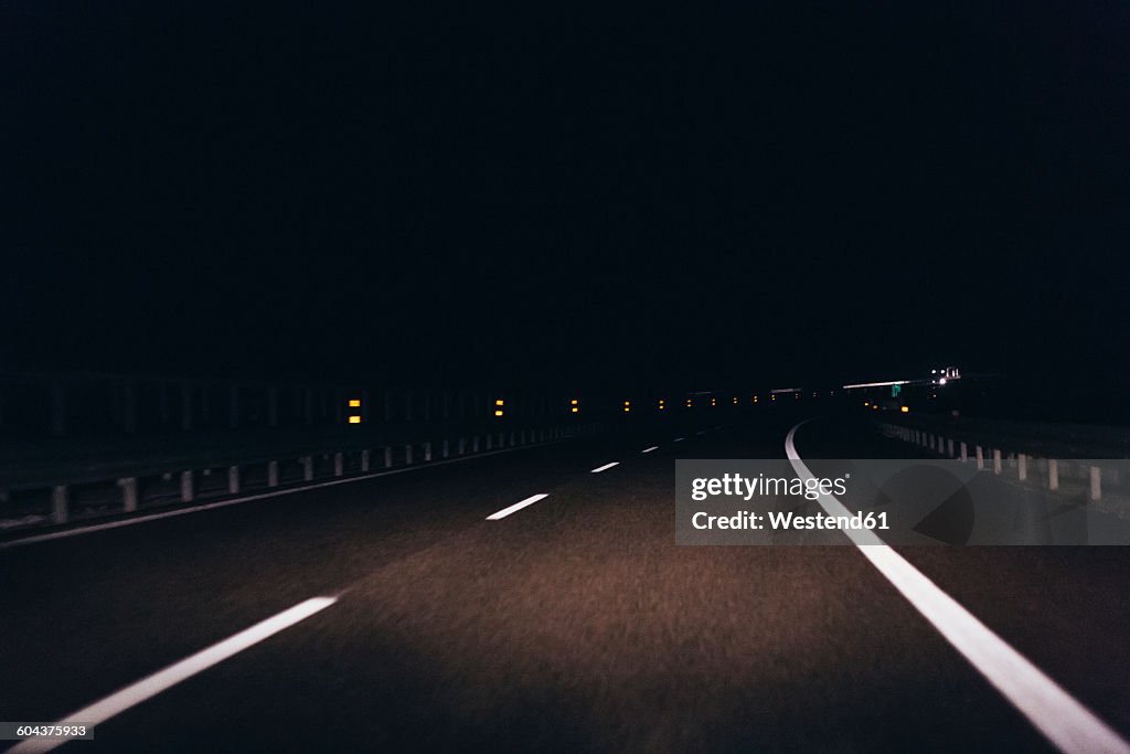Italy, Udine, driving at night along the highway