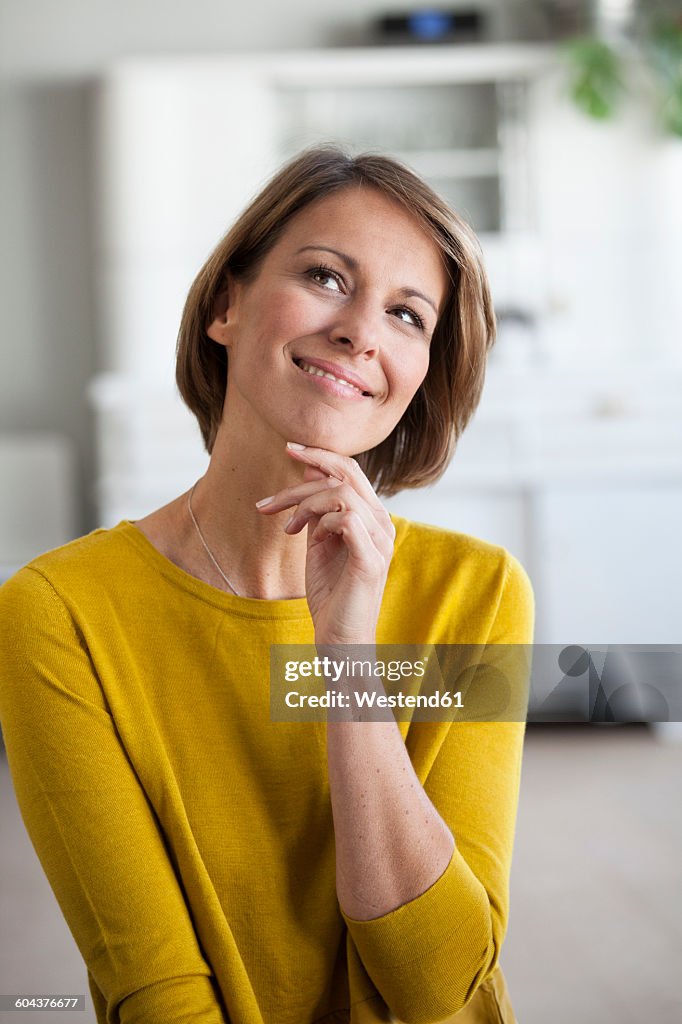 Portrait of smiling woman looking up