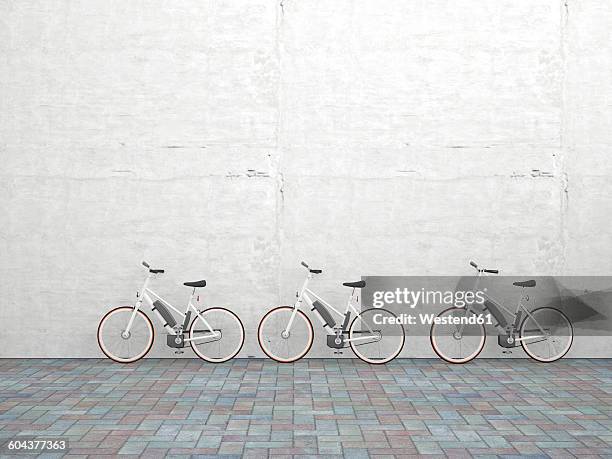 row of three parked electric bicycles in front of concrete wall, 3d rendering - concrete wall stock illustrations