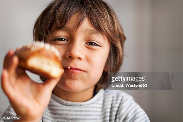 little boy holding brioche - brioche stock pictures, royalty-free photos & images