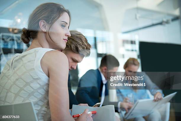 businessswoman in a meeting looking away - looking away stock pictures, royalty-free photos & images