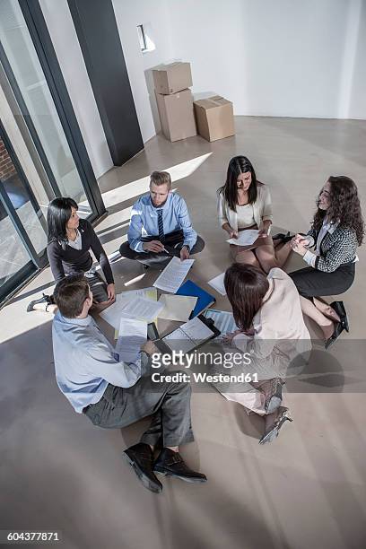 businesspeople working in new open office - makeshift office stock pictures, royalty-free photos & images