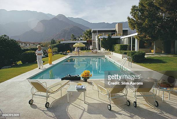 Former fashion model Helen Dzo Dzo Kaptur and Nelda Linsk , wife of art dealer Joseph Linsk, at the Kaufmann Desert House in Palm Springs,...