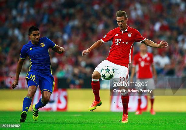 Joshua Kimmich of Bayern Muenchen and Christian Noboa of FC Rostov in action during the UEFA Champions League Group D match between FC Bayern...