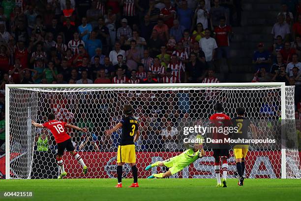 Andres Guardado of PSV Eindhoven takes a penalty which is saved by Jan Oblak of Atletico Madrid during the UEFA Champions League Group D match...