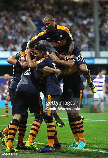 Ciaran Clark of Newcastle United is congratulated after scoring a goal during the Sky Bet Championship match between Queens Park Rangers and...