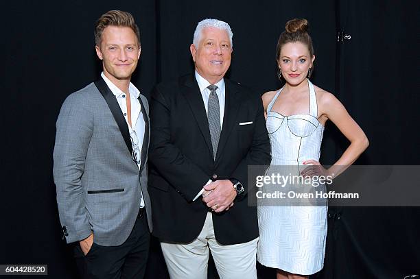 Photographer Nathan Johnson, designer Dennis Basso, and Laura Osnes pose for a photo backstage at the Dennis Basso fashion show during New York...