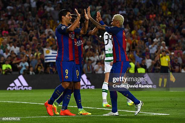 Luis Suarez of Barcelona celebretes scoring his sides sixth goal with team mates during the UEFA Champions League Group C match between FC Barcelona...