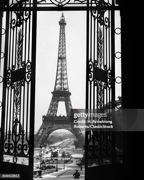 1920s EIFFEL TOWER BUILT 1889 SEEN FROM TROCADERO WROUGHT IRON DOORS PARIS FRANCE