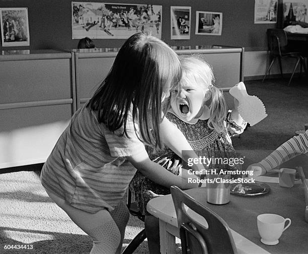 1970s ARGUMENT BETWEEN TWO PRE-SCHOOL KINDERGARTEN GIRLS BLONDE GIRL SCREAMING