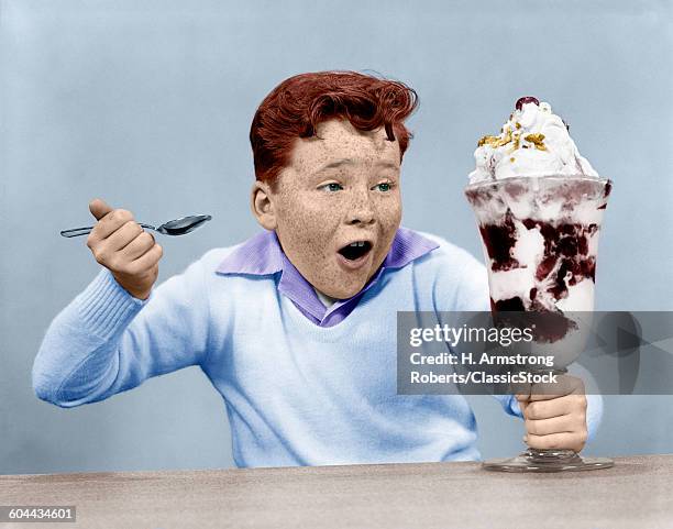 1950s FRECKLE FACE BOY DIGGING INTO GIANT ICE CREAM SUNDAE