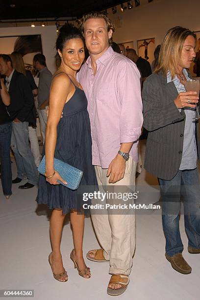 Meghan Markle and Trevor Engelson attend COACH Legacy Photo Exhibit by REED KRAKOFF at Coach on August 26, 2006 in East Hampton, NY.