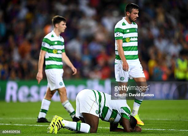 Kolo Toure of Celtic reacts to an injury during the UEFA Champions League Group C match between FC Barcelona and Celtic FC at Camp Nou on September...