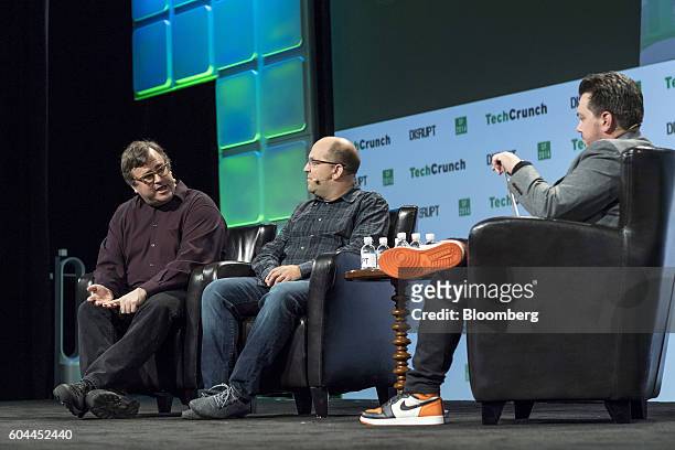 Reid Hoffman, chairman and co-founder of LinkedIn Corp., left, speaks as Josh Elman, principal at Greylock Partners, center, listens during the...
