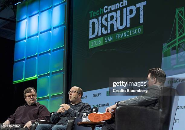 Josh Elman, principal at Greylock Partners, center, speaks as Reid Hoffman, chairman and co-founder of LinkedIn Corp., left, listens during the...