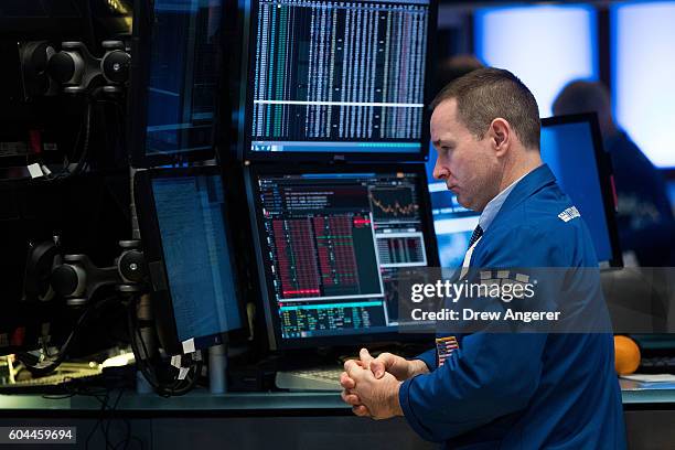Traders and financial professionals work on the floor of the New York Stock Exchange ahead of the closing bell, September 13, 2016 in New York City....