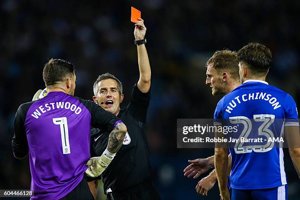 Sam Hutchinson of Sheffield Wednesday is given a red card during the Sky Bet Championship fixture between Sheffield Wednesday and Bristol City at...