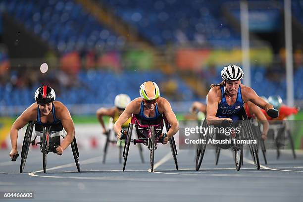 Chelsea McClammer, Amanda McGrory and Tatyana McFadden of the United States celebrate winning the silver, bronze and gold medals respectively in the...