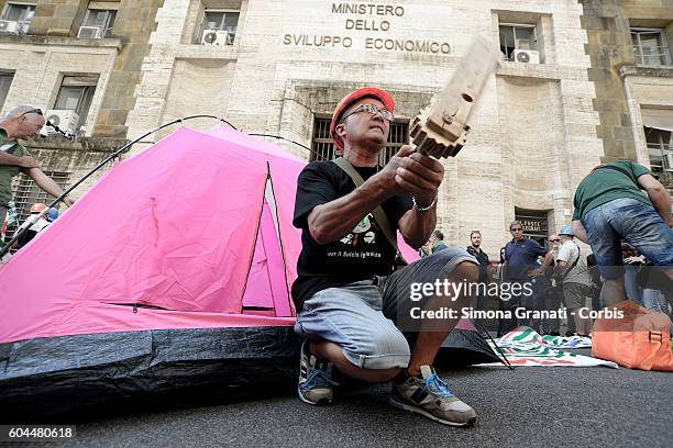 Former Alcoa workers, of Portovesme in Sardinia, protesting at the Ministry of Economic Development, to ask the Government Renzi to say what his...