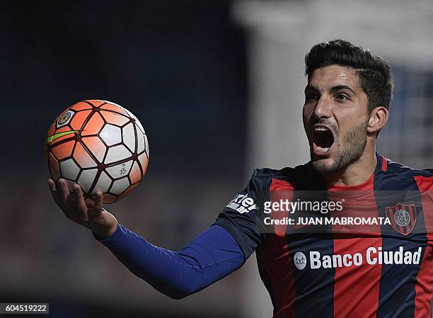 Argentina's San Lorenzo forward Nicolas Blandi celebrates after scoring the team's third and his second goal against Argentina's Banfield during...