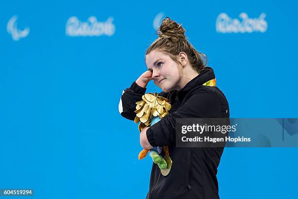 Nikita Howarth of New Zealand stands on the podium after winning the gold medal in the Women's 200m Individual Medley SM7 final on day 6 of the Rio...