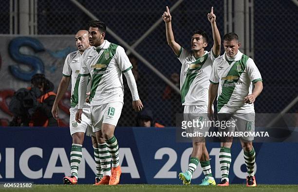 Argentina's Banfield defender Alexis Soto celebrates next to teammates after scoring a goal against Argentina's San Lorenzo during their Copa...