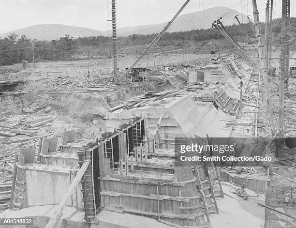 Ashokan reservoir, view showing construction of dividing weir with gate-house in foreground, 1913. Note four 5-foot by 15-foot sluice-gates in place,...