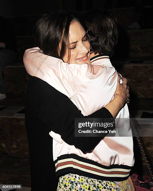 Winona Ryder hugs Millie Bobby Brown at the Coach 1941 Women's Spring 2017 Show at Pier 76 on September 13, 2016 in New York City.