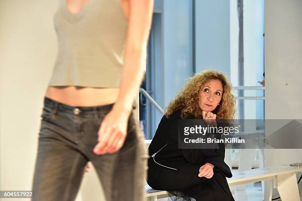 Designer Reem Acra watches her models during rehearsal just before the start of the Reem Acra show during September 2016 New York Fashion Week Show...
