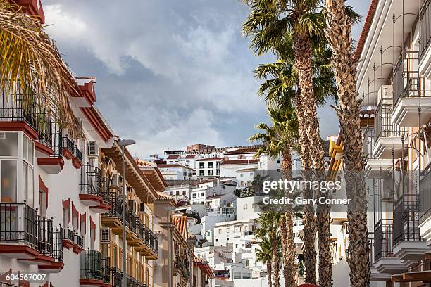 church and castle overlook town - salobreña stock pictures, royalty-free photos & images