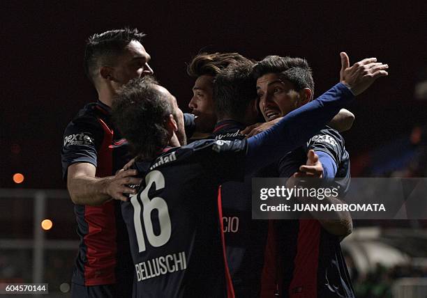 Argentina's San Lorenzo forward Nicolas Blandi celebrates with teammates after scoring the team's second goal against Argentina's Banfield during...