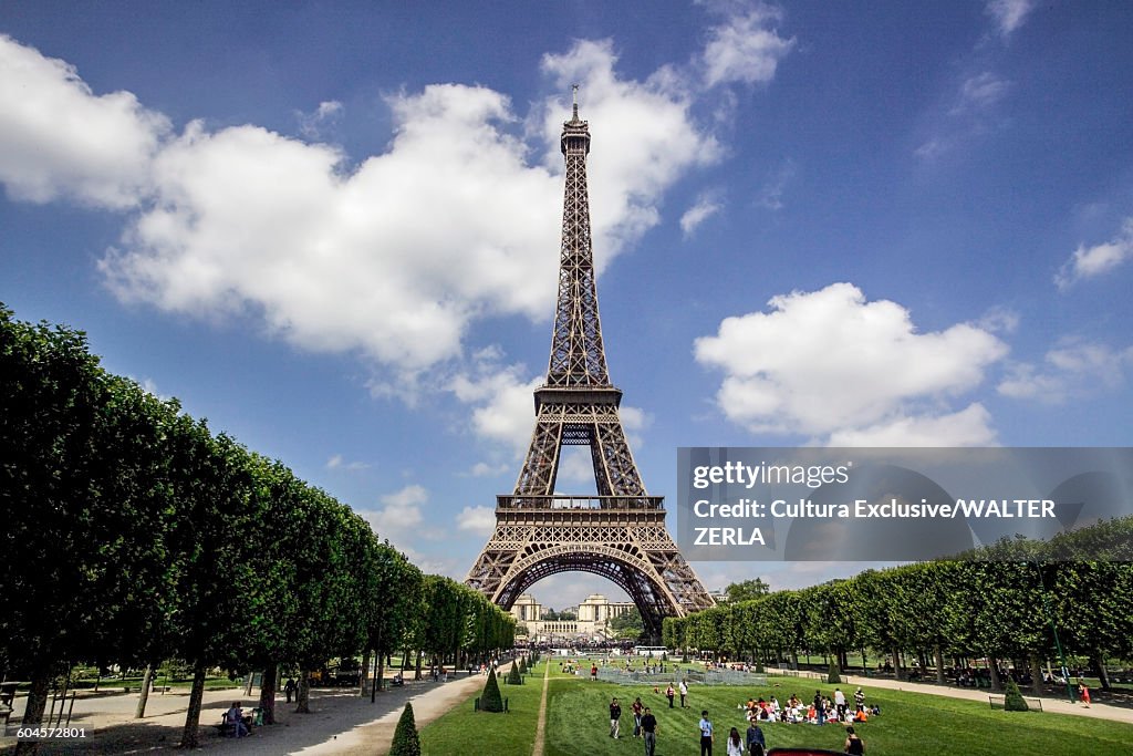 Tourists in Eiffel Tower park, Paris, France