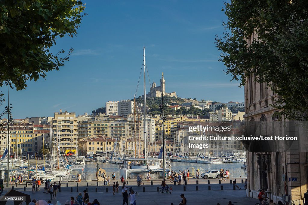 Boats in marina, Vieux-Port, Notre Dame de la Garde in background, Marseille, France