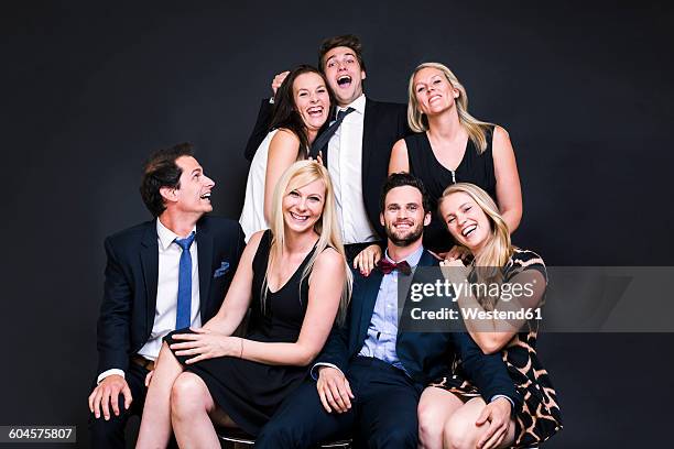 group of well-dressed happy friends - medium group of people stock pictures, royalty-free photos & images